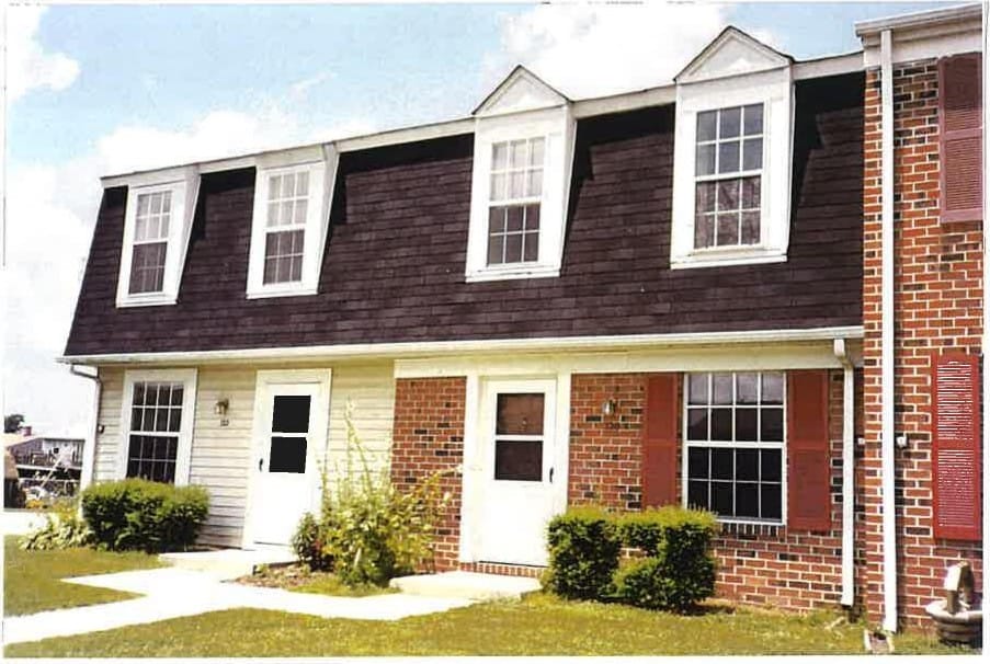 Taneytown Village townhouses in brick and siding with dormer windows and neat front entries